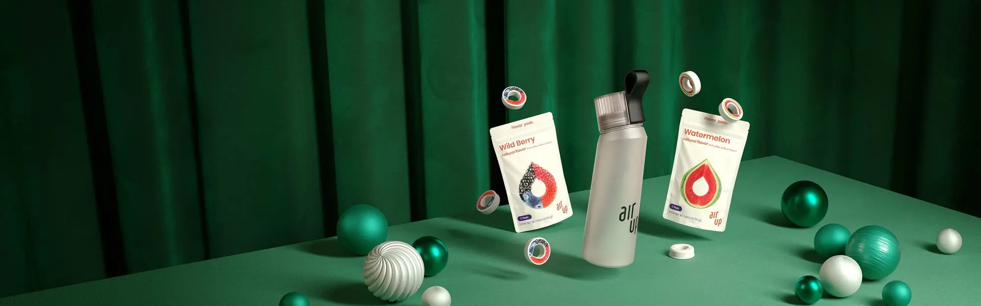A Pearl White air up bottle sits in a holiday scene with wild berry and watermelon pods